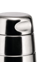 Stainless steel cocktail shaker by Alessi, close-up with a brushed metallic finish and curved indentations.