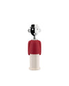 A red and cream "Alessandro M." corkscrew by Alessi, designed as a smiling man with a black and white face and bowler hat.