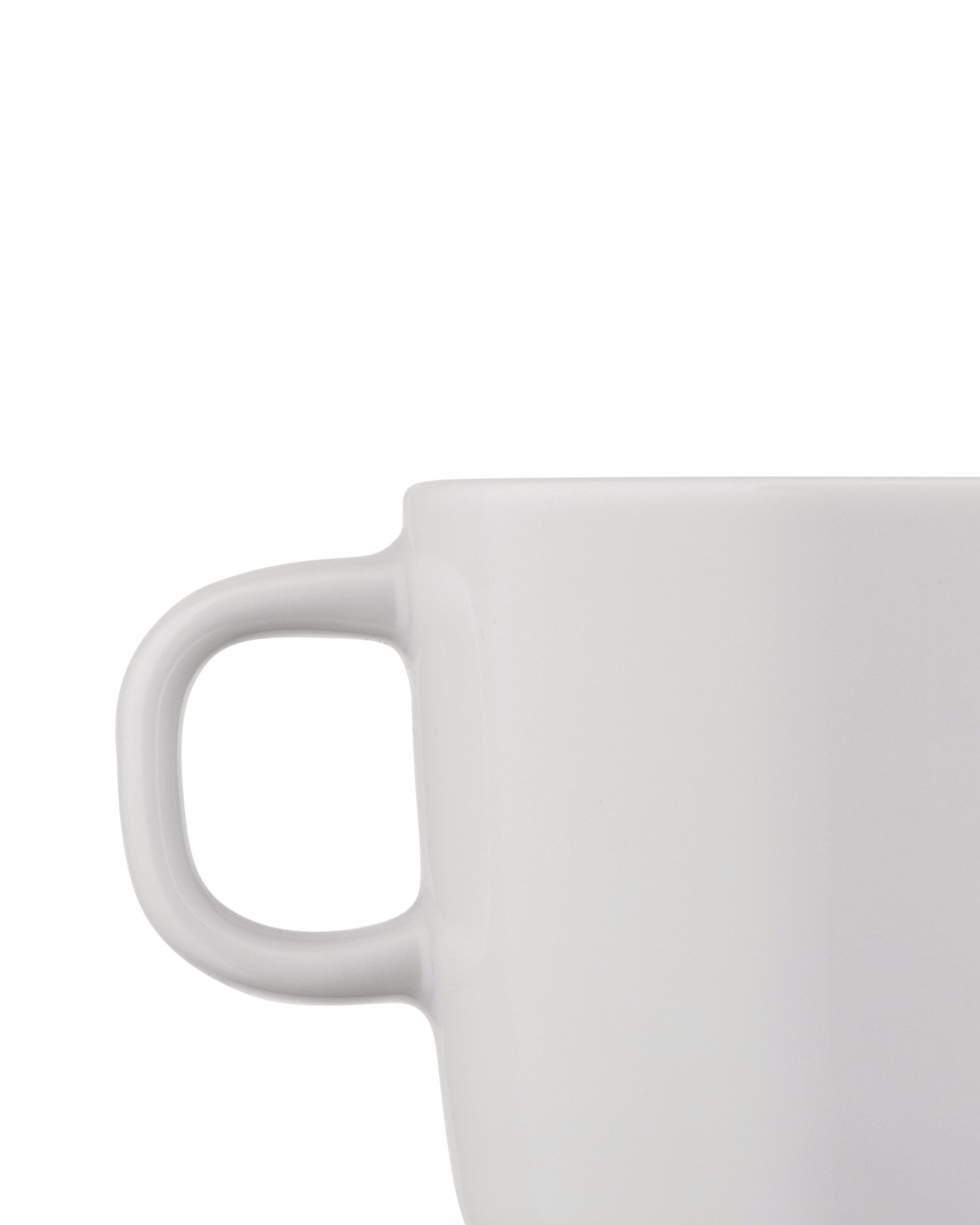 White cup by Alessi, cropped, showing a simple handle against a white background.