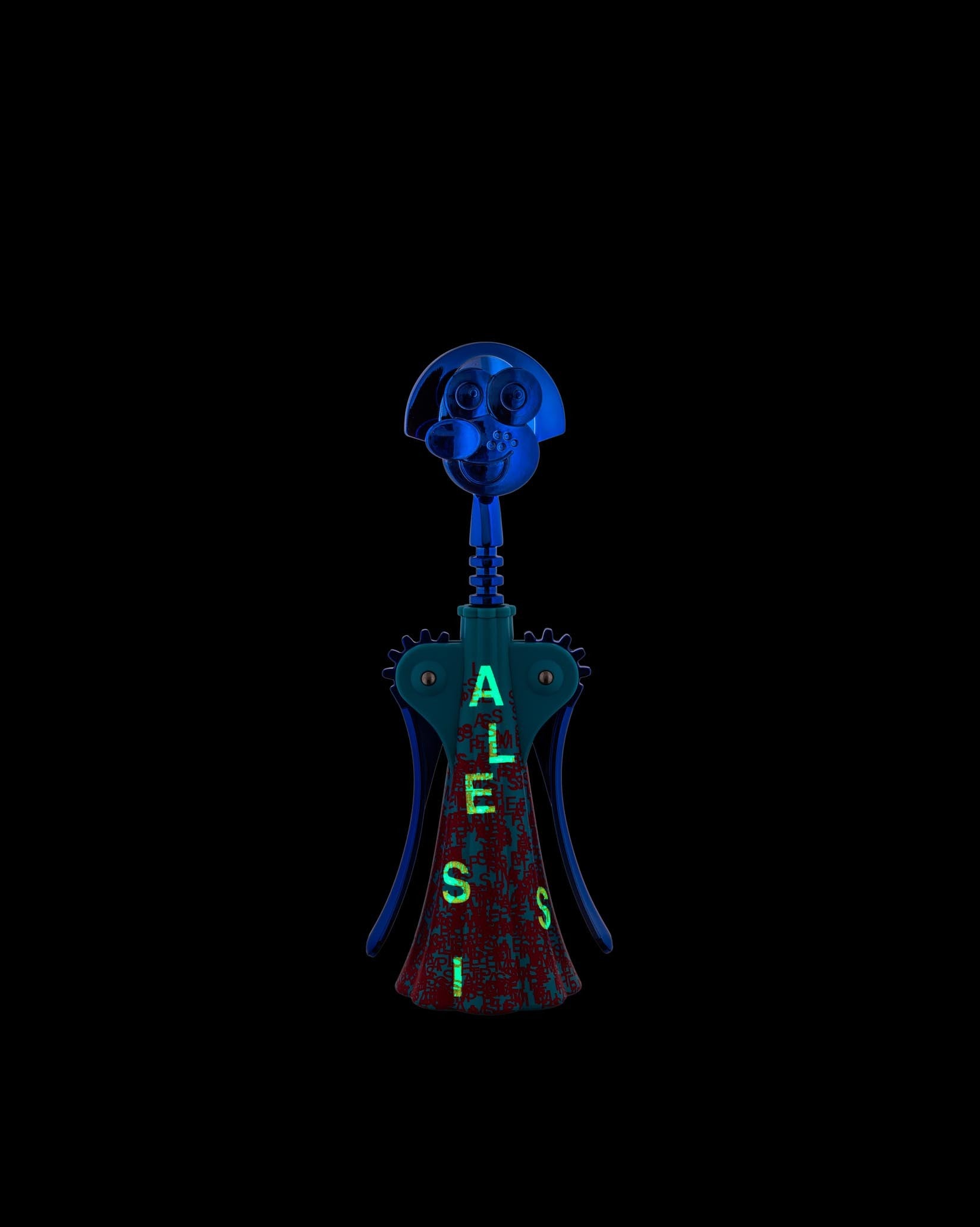 Anthropomorphic corkscrew by Alessi with a blue dog-like head, teal body with red pattern, and glowing green "ALESSI" text.
