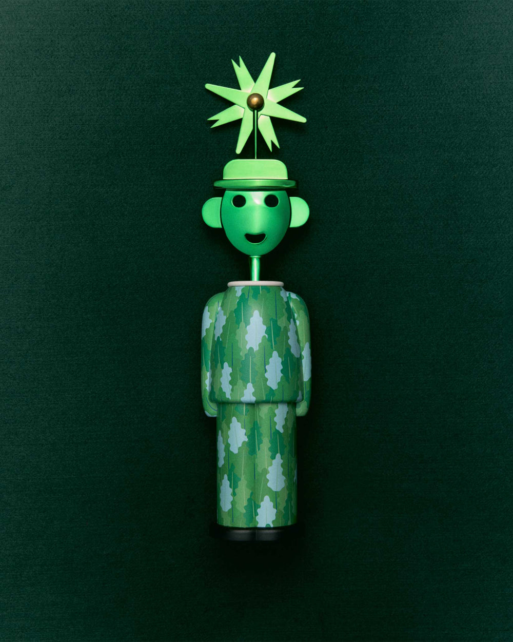 Green corkscrew by Alessi styled as a whimsical figure with a leaf-patterned body and a pinwheel hat.