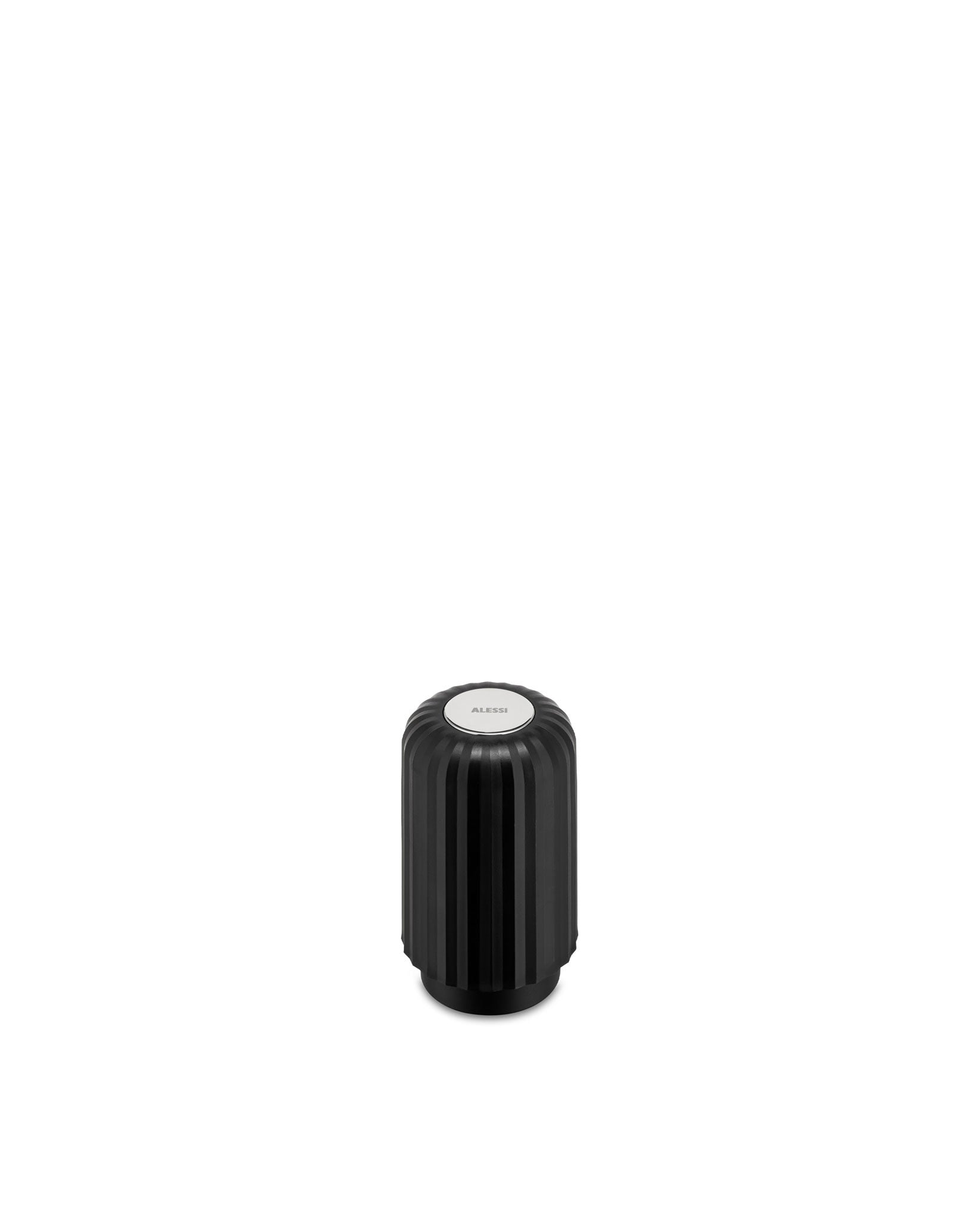 Black ribbed capsule crusher by Alessi with a silver circular top.
