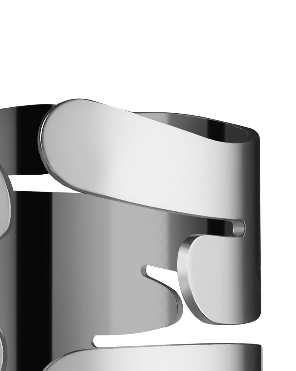 Silver metal Barkring napkin holder by Alessi, featuring organic, cutout shapes in a close-up side view.