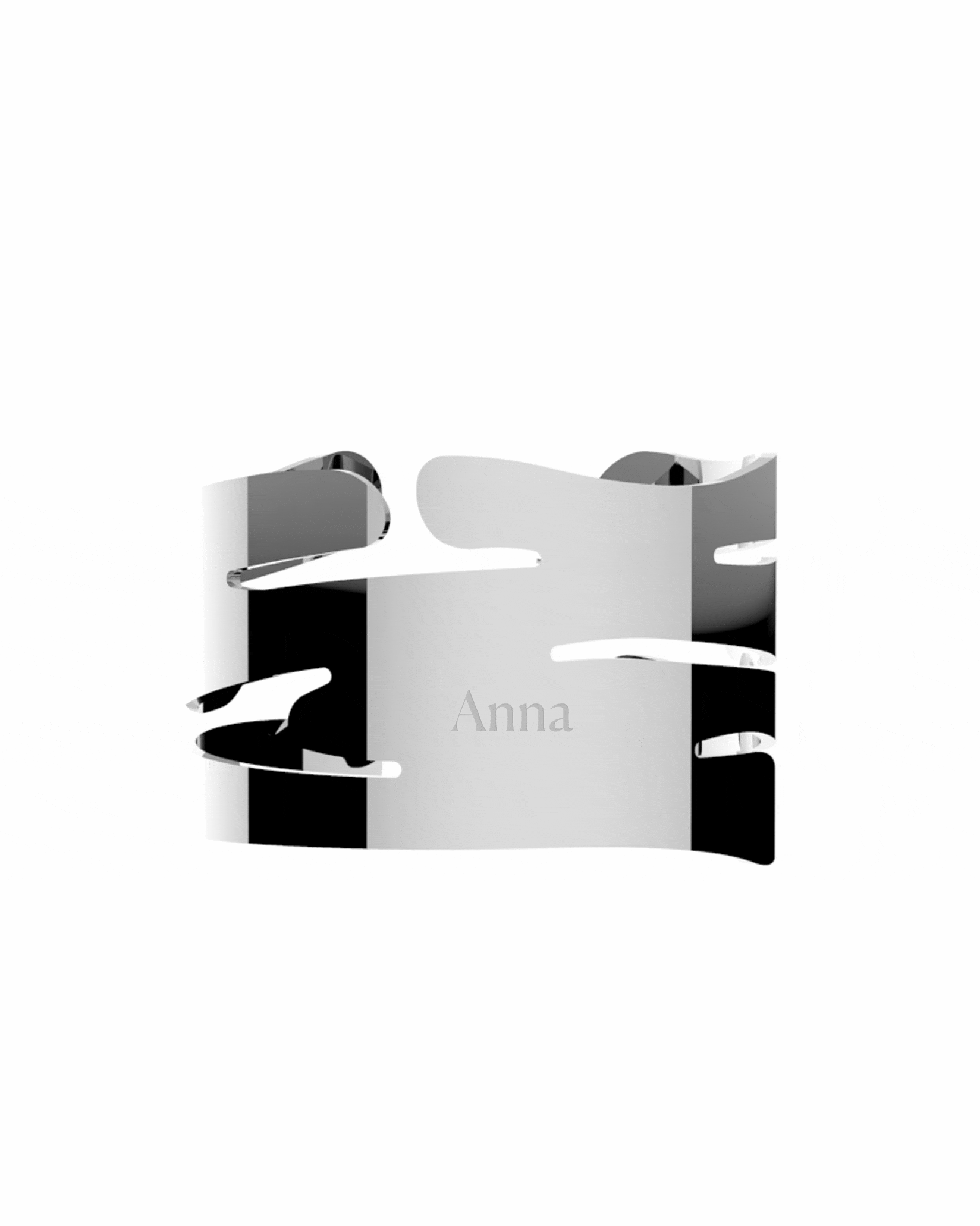 Polished silver metal napkin holder by Alessi, featuring organic bark-like cutouts and 'Anna' engraved.