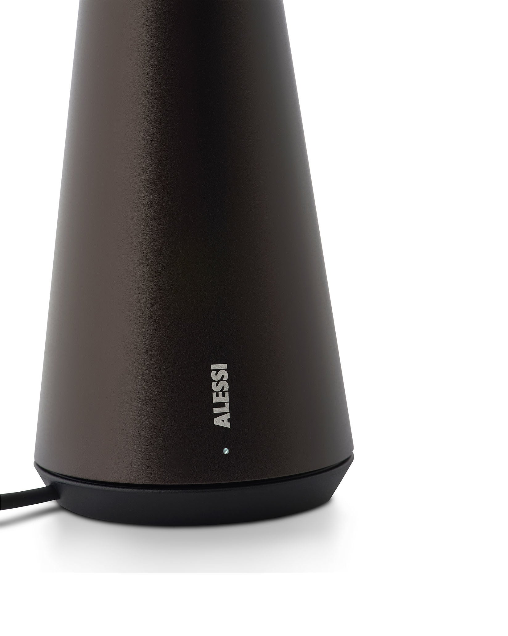 Dark brown conical lamp by Alessi with a textured matte finish, black base, a visible power cord, and a small white indicator light.