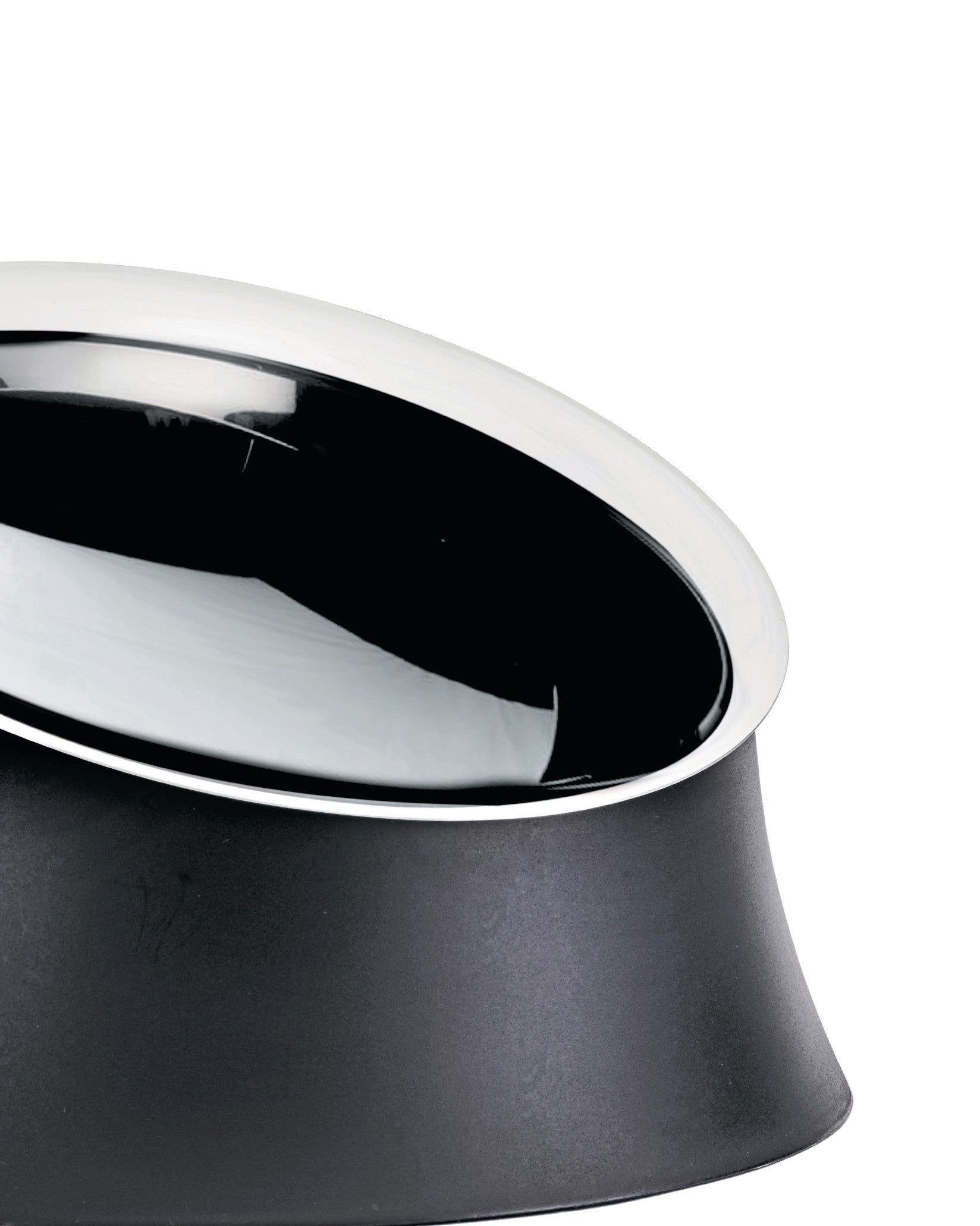 Black dog bowl by Alessi with a gleaming chrome-plated rim and a matte textured base.