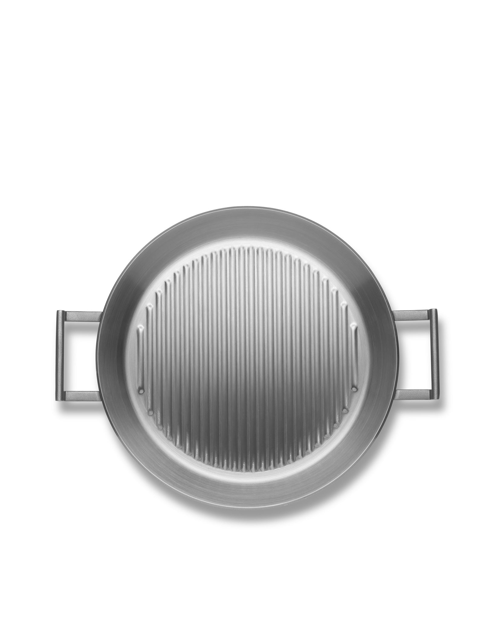 Round silver grill pan by Alessi with parallel raised ridges and rectangular loop handles.