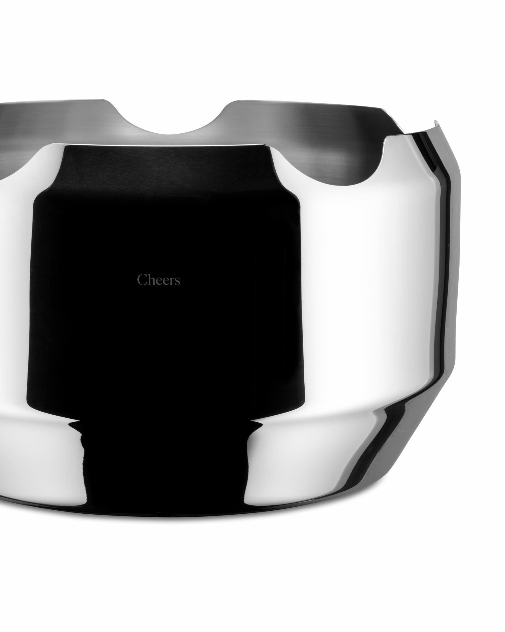 Polished stainless steel wine cooler by Alessi with undulating top and 'Cheers' inscription, shown cropped.