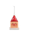 Cubocchio Christmas tree ornament by Alessi, featuring a peach cube body, red pointy roof with white flowers, two black eyes, and a pink nose.