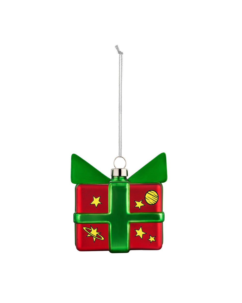 Red and green gift box Christmas tree ornament by Alessi, featuring yellow stars, a planet, and a silver hanging chain.