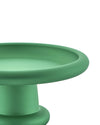 Green matte centerpiece stand by Alessi with a wide, round top and textured surface, cropped.
