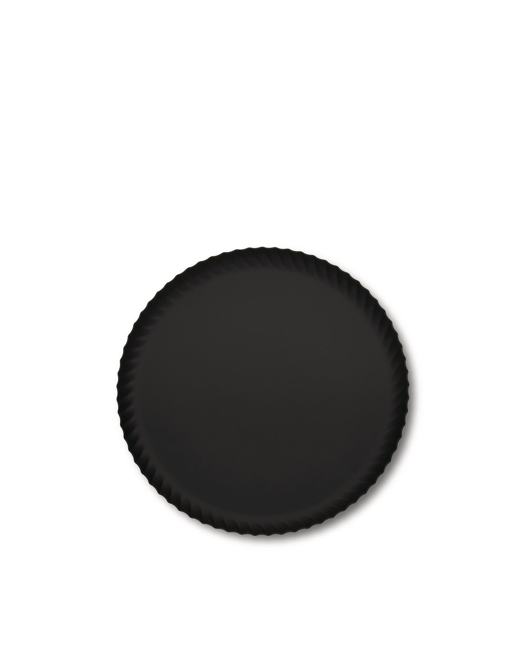 A black, round tray by Alessi with a pleated edge, viewed from above.