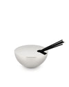 Silver Rocc fragrance diffuser by Alessi with black reeds in a sleek, bowl-shaped holder.
