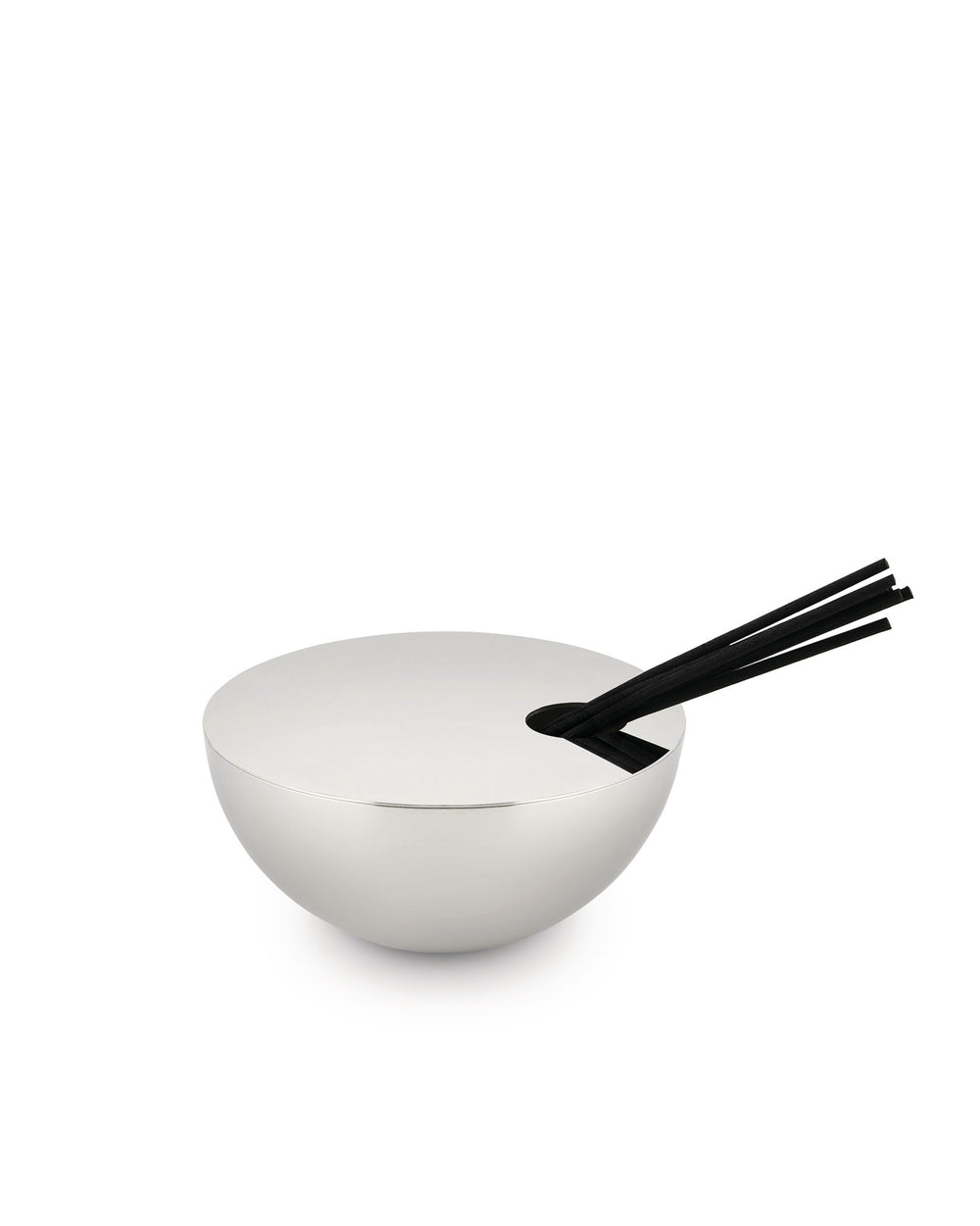 Silver Rocc fragrance diffuser by Alessi with black reeds in a sleek, bowl-shaped holder.