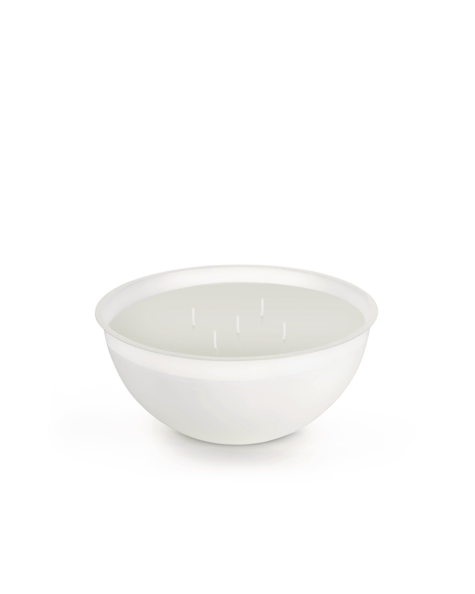White five-wick candle by Alessi in a wide, shallow white bowl, shown from a slightly elevated angle.