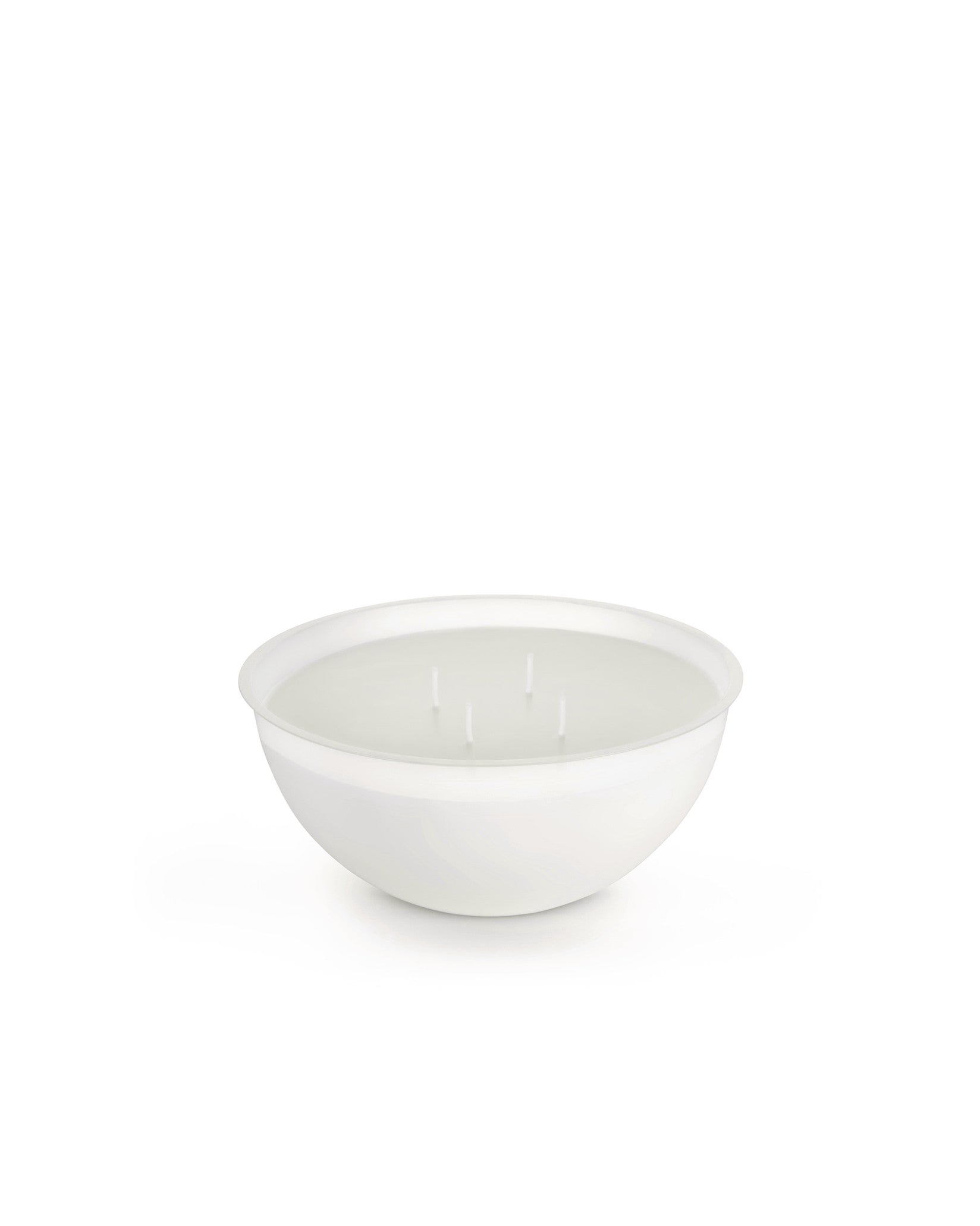 White multi-wick candle in a bowl by Alessi, featuring four wicks in a minimalist design.