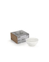 White, bowl-shaped Rocc candle by Alessi with three wicks, shown with its brown and metallic box labeled 'Marble'.