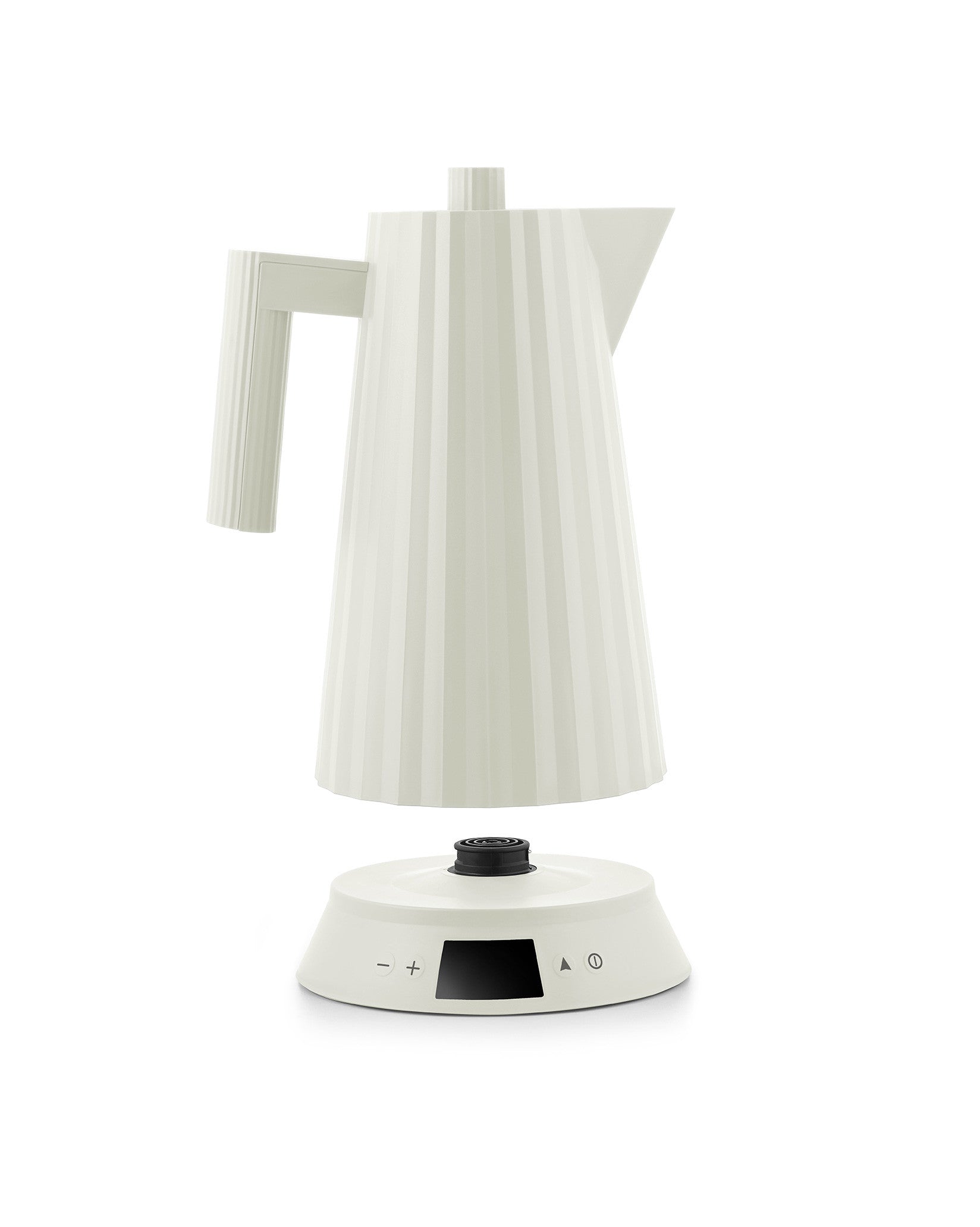 Off-white electric kettle by Alessi with a pleated texture, separated from its base featuring a digital control panel.