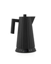 Black electric kettle by Alessi with a ribbed texture and digital temperature display showing 100°.