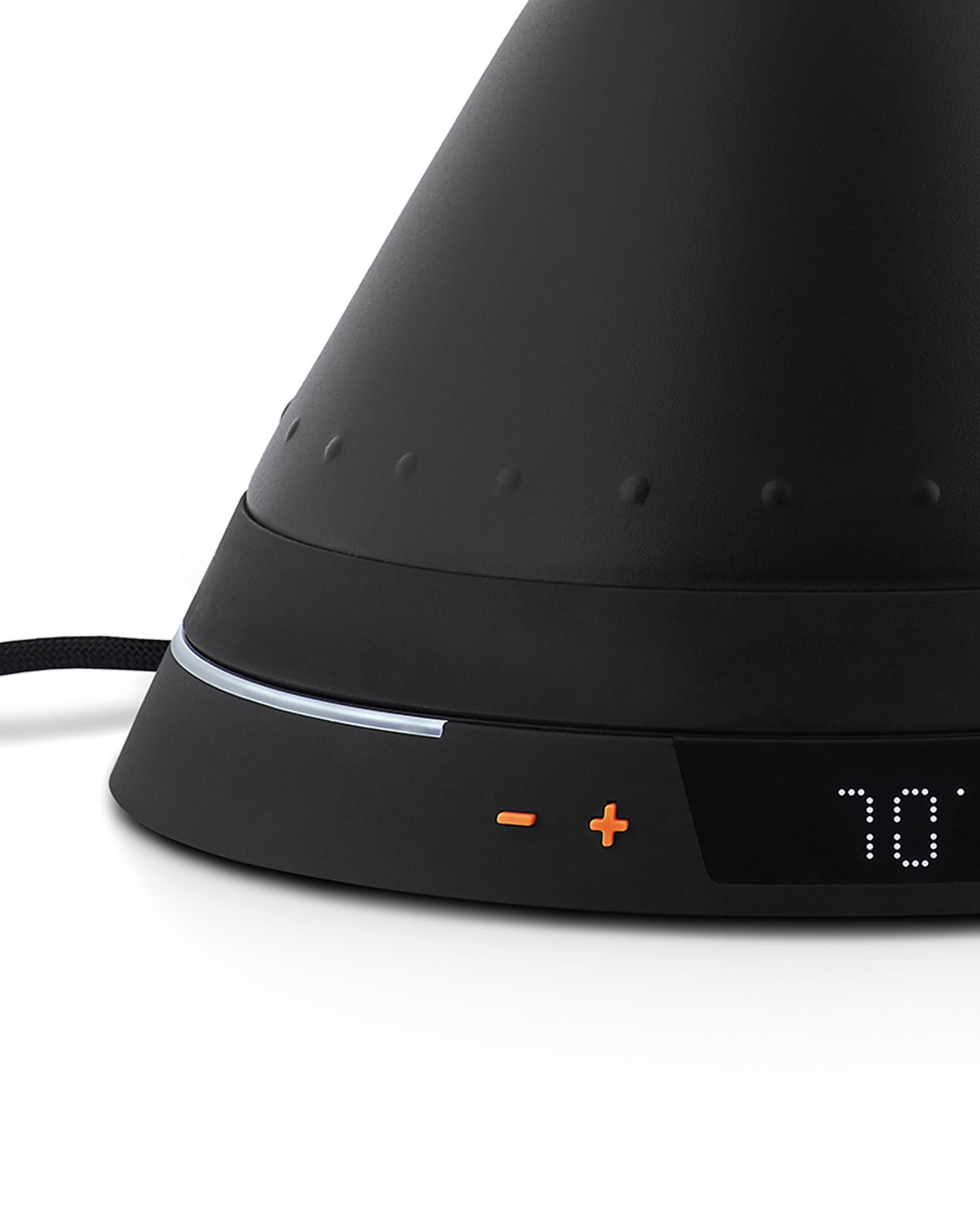 Black electric kettle by Alessi with a matte finish, raised dot texture, silver band, orange temperature controls, and a '70' digital display.