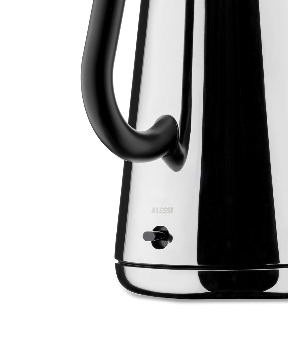 Polished stainless steel electric kettle by Alessi with a black ergonomic handle and power switch, cropped view.