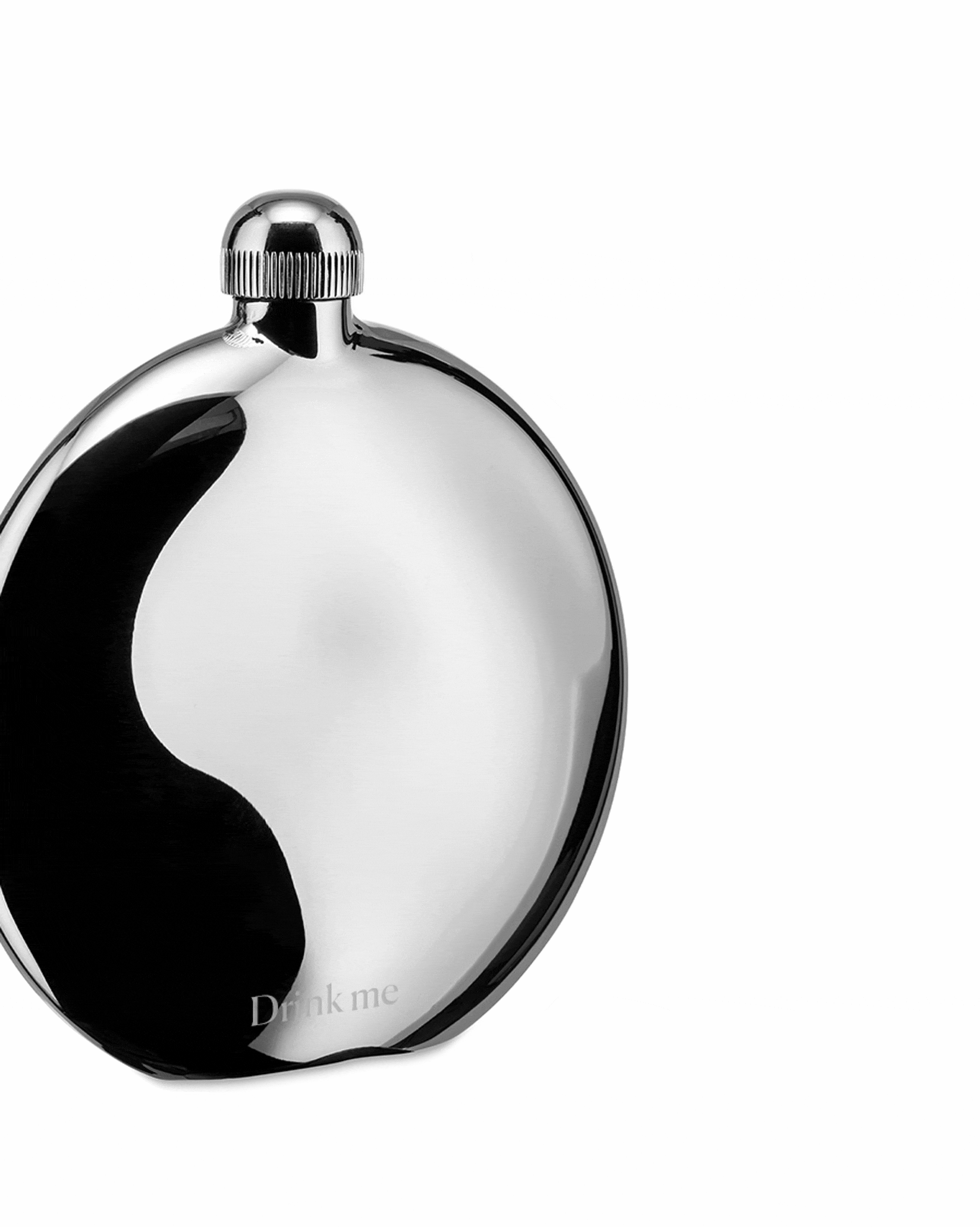 Round shiny silver stainless steel hip flask by Alessi, with a ribbed cap and 'Drink me' etched on the side.