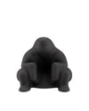 Black matte Dédé doorstop by Alessi, shaped like a squatting figure on a white background.