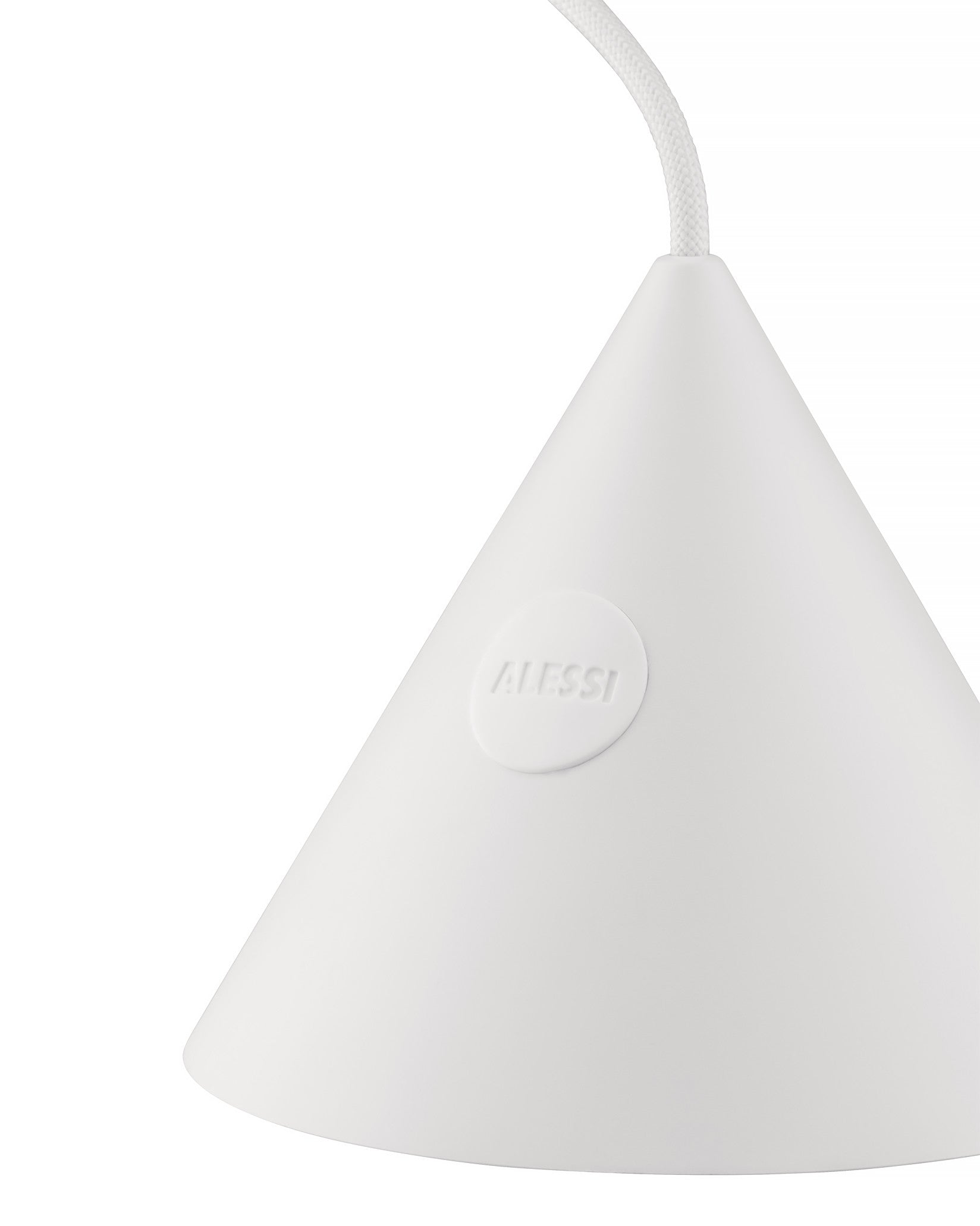 White cone-shaped lamp by Alessi with an embossed logo and a braided white power cord, cropped.