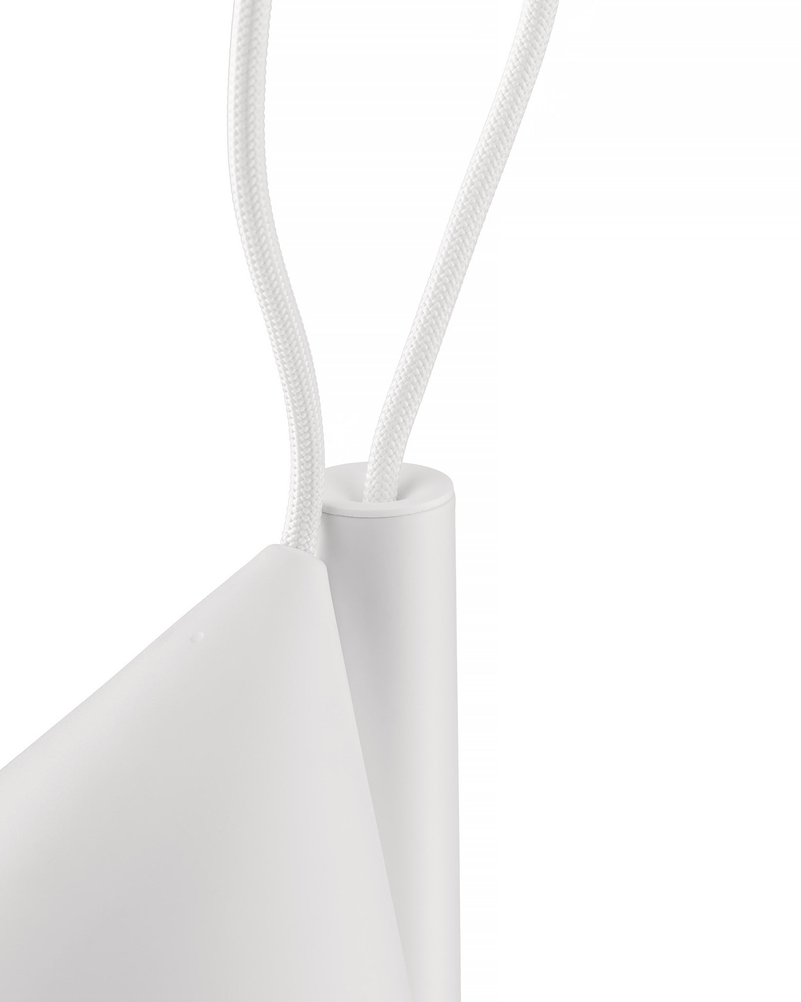 White Tsumiki lamp by Alessi with braided cords entering cylindrical and conical elements, close-up.