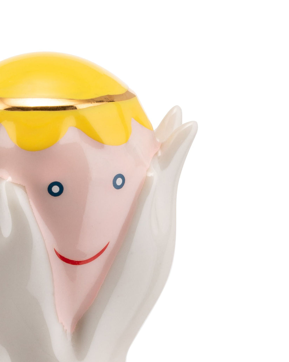 Happy Eternity Baby figurine by Alessi, with yellow hair, pink face, blue dot eyes, a red smile, and white hands.