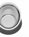 White and silver reflective dog bowl by Alessi with a dark grey base and 'Nino' text.