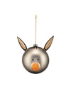 Silver donkey Christmas ornament by Alessi, with long ears, black eyes, and an orange smiling snout, hanging from a gold string.