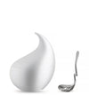 White sugar bowl by Alessi, tear-drop shaped with a curved spout, accompanied by a silver slotted ladle.