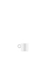 White ceramic espresso cup by Alessi with a simple round handle, isolated on white.