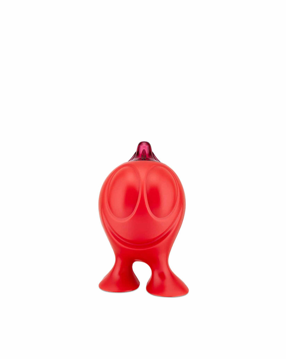 Red anthropomorphic Gino Zucchino sugar dispenser by Alessi, with a smiling face, purple spout, and two feet.