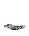 Port decorative bowl by Alessi, silver metallic with a wavy design and reflective surface.