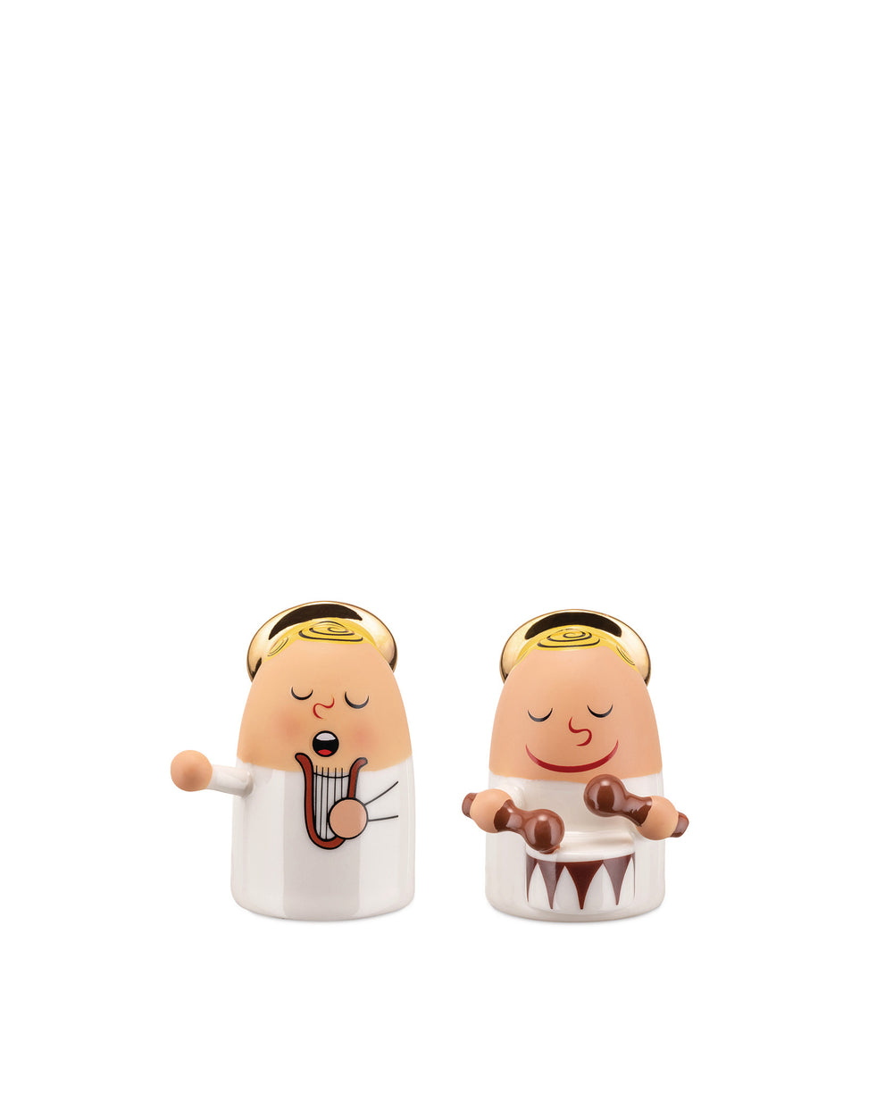 Two white and beige ceramic angel figures by Alessi, one playing a harp and the other drums, both with golden halos.