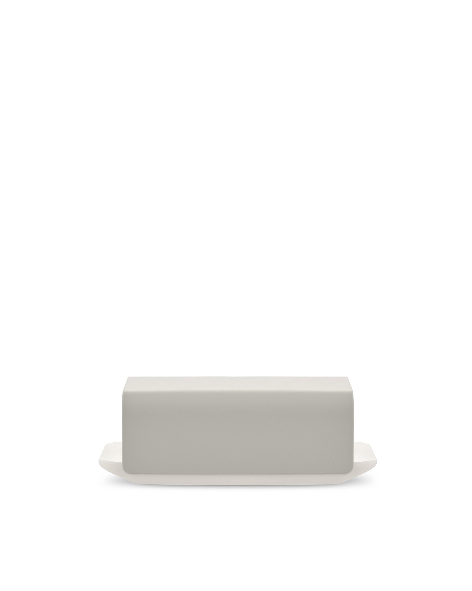 Light grey matte butter dish by Alessi, with a white base on a white background.