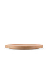 Round light wood board by Alessi with subtle elevation and visible wood grain.