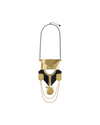 Gold and black geometric statement necklace by Alessi with layered metal and a textured circular pendant.