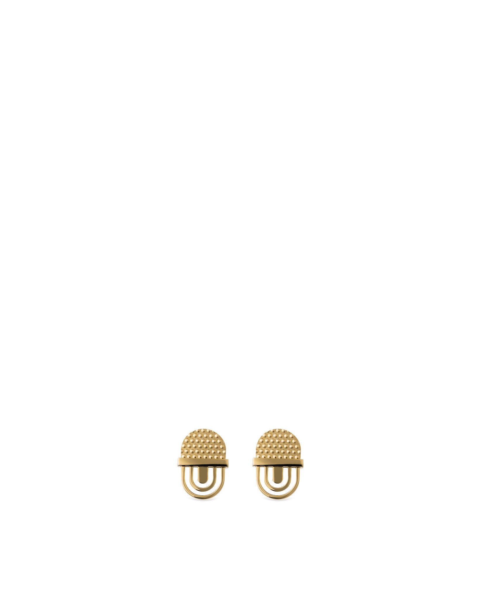 Pair of golden decorative studs by Alessi, with textured domed tops and a double U-shaped base.
