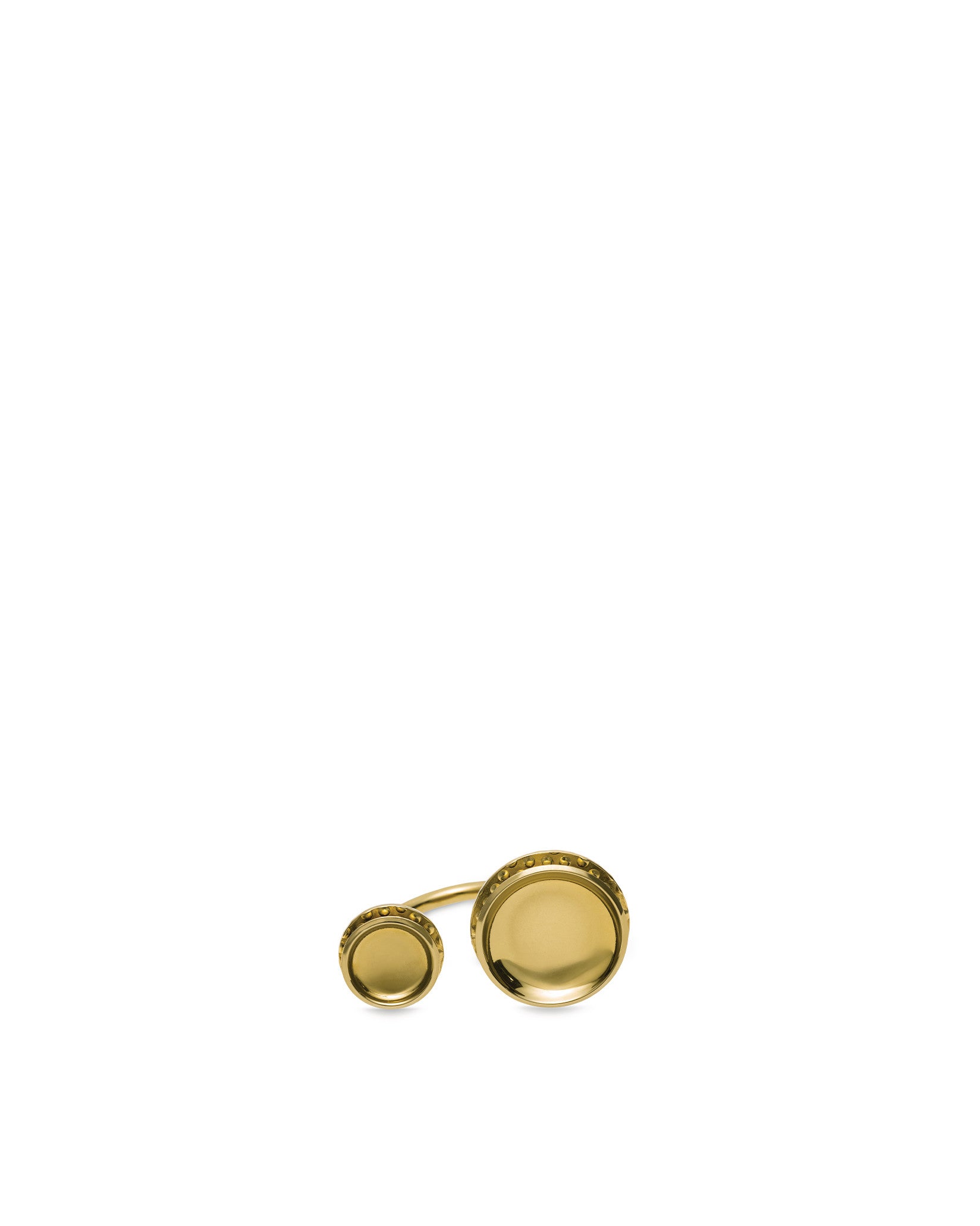Gold metallic cufflink by Alessi featuring two concave circular elements with textured edges.