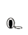 Polished chrome spherical keychain container by Alessi, with a split ring, shown from a side view.