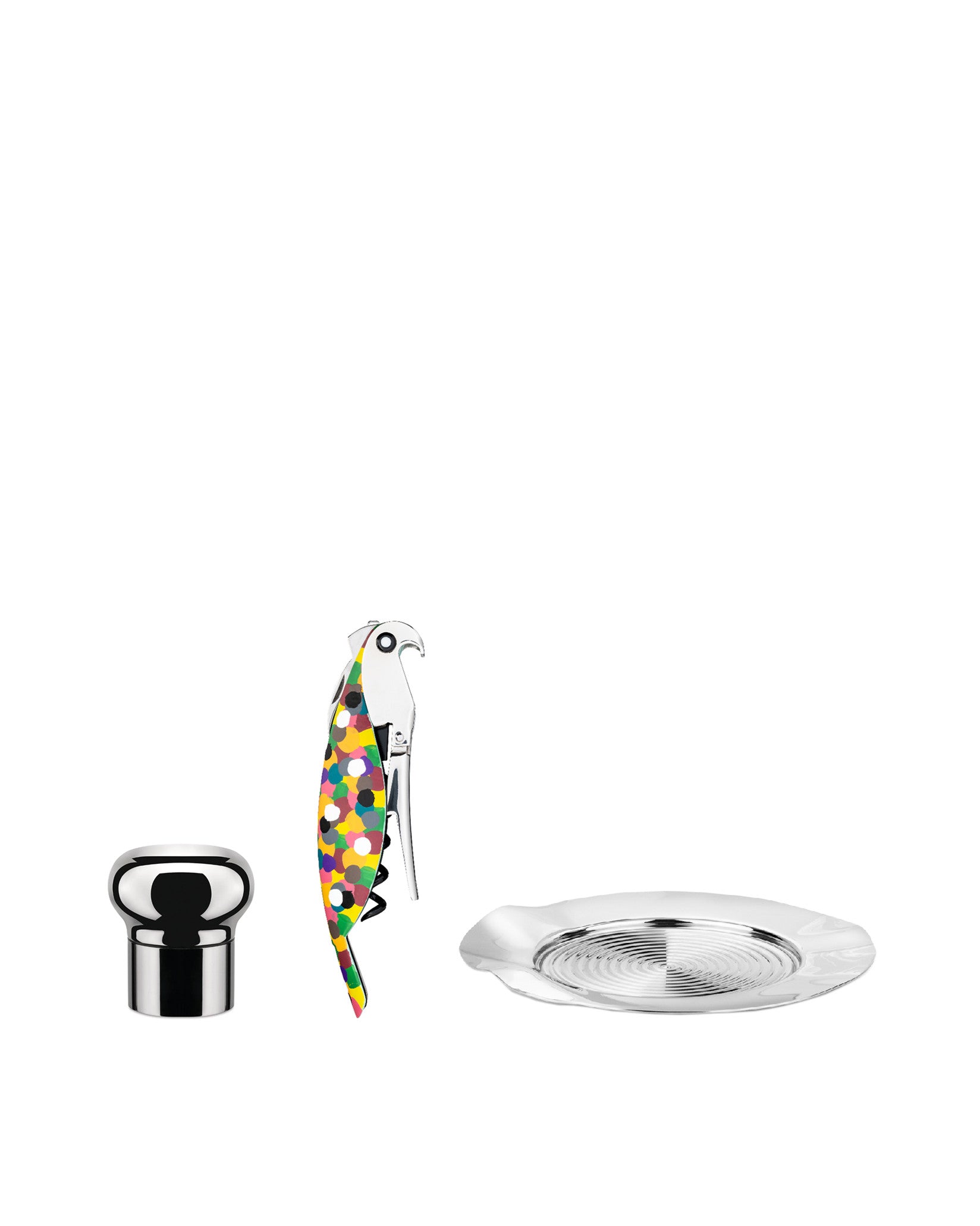 A mixology set by Alessi featuring a chrome bottle stopper, a parrot corkscrew with colorful polka dots, and a silver grooved coaster.