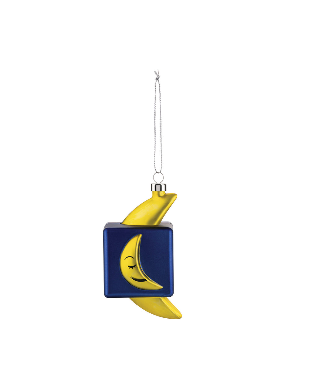 A blue and yellow Mooncube ornament by Alessi, featuring a sleeping moon face, hanging from a silver chain.