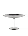 Silver polished metal fruit stand by Alessi, with a distinctive scalloped edge and sleek base.