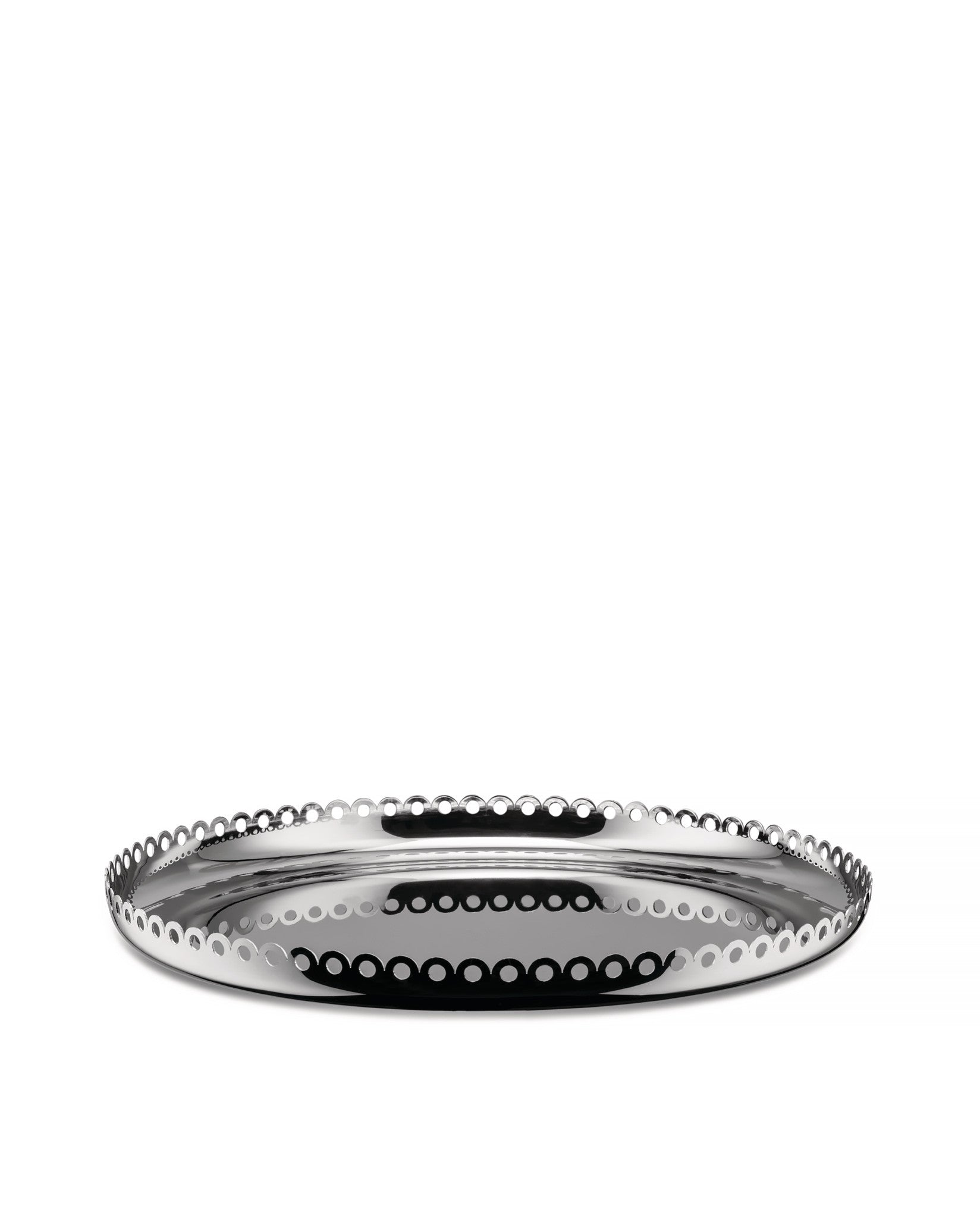 Reflective silver fruit bowl by Alessi with an intricate perforated scalloped edge design, low angle.