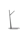 Chrome fruit stand by Alessi with a minimalist tree-like branch design and an oval base.