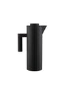 Black thermos jug by Alessi with a vertical pleated texture, handle, and pouring spout.
