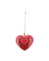 Red heart ornament by Alessi, hanging from a gold chain, adorned with red gems and a gold-framed smiley heart face.